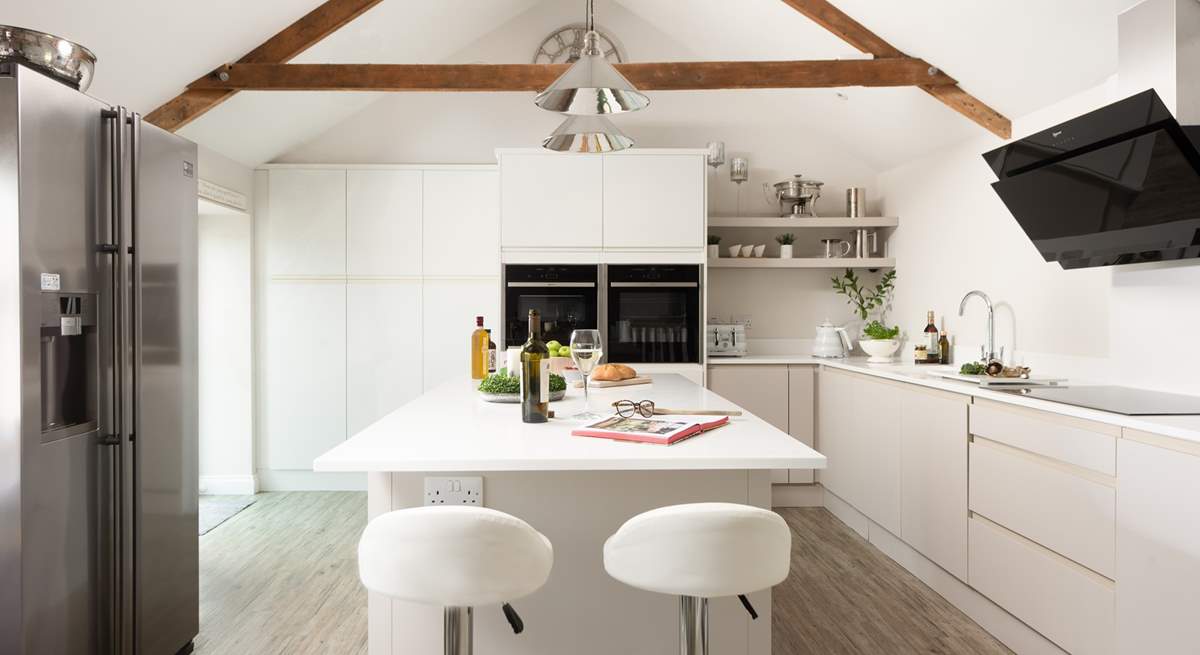 The kitchen area is incredibly sleek and stylish.