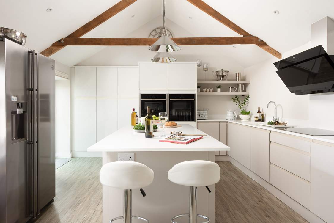 The kitchen area is incredibly sleek and stylish.