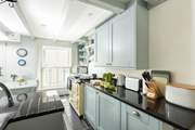 The kitchen has a fabulous electric Aga.