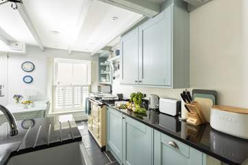The kitchen has a fabulous electric Aga.
