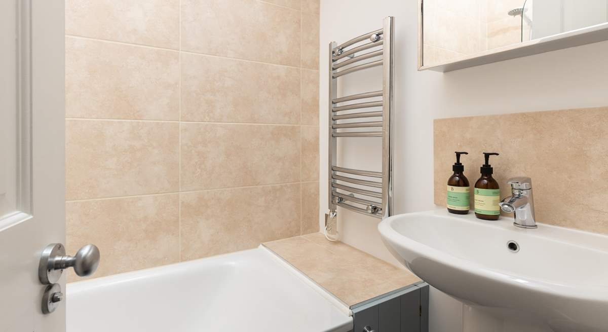 The family bathroom on the first floor has a bath with shower over.