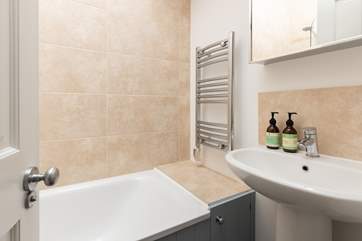 The family bathroom on the first floor has a bath with shower over.