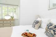 The gorgeous double bedroom has a comfy king-size bed.