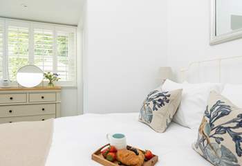 The gorgeous double bedroom has a comfy king-size bed. 