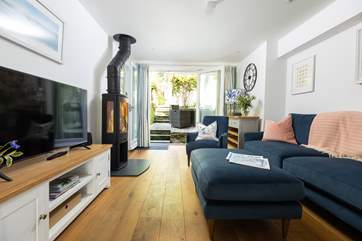 The stylish open plan living area leads out onto a secluded terrace.