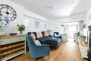 This inviting space is perfect for either a family or friends. Please note there is a step down to the kitchen area.