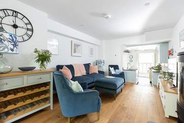This inviting space is perfect for either a family or friends. Please note there is a step down to the kitchen area.