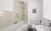 The en suite bathroom to bedroom 1 has a bath with shower over. - Thumbnail Image