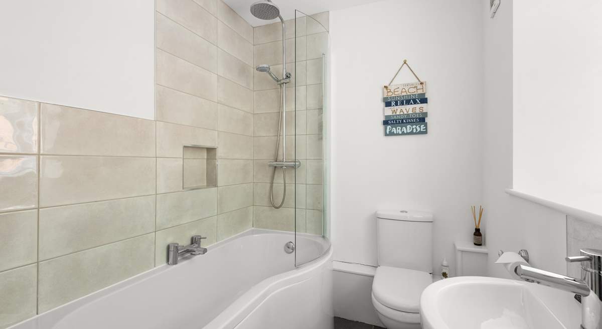 The en suite bathroom to bedroom 1 has a bath with shower over.