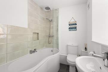 The en suite bathroom to bedroom 1 has a bath with shower over.