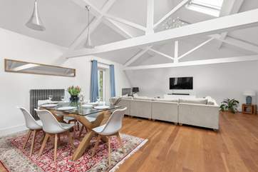 The Flint Coach House is beautifully constructed with high ceilings and exposed beams.