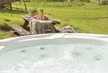 Pour a glass of your favourite and unwind in the bubbling hot tub. 
