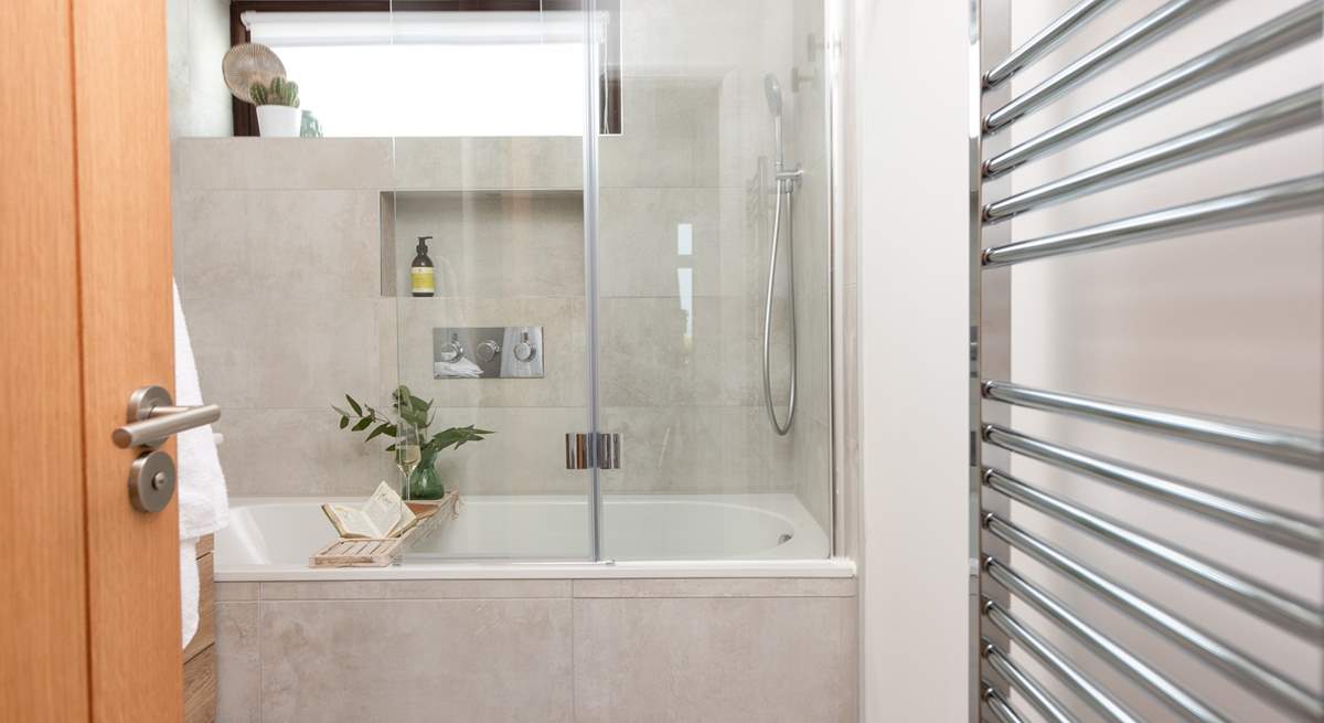 The contemporary family bathroom has a dreamy bath for a long soak after a day out and about, and a shower so you get the best of both worlds.