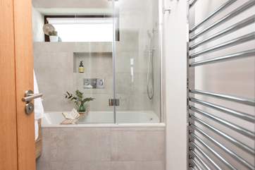The contemporary family bathroom has a dreamy bath for a long soak after a day out and about, and a shower so you get the best of both worlds.