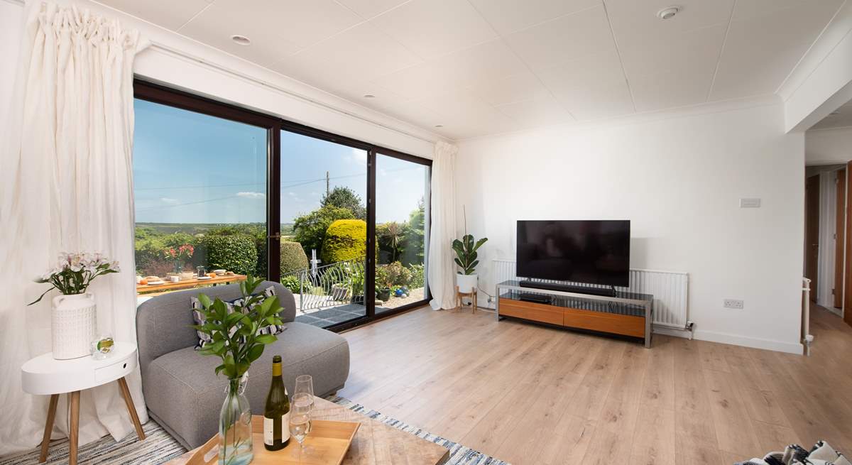 The patio doors open up onto the terrace and sea view. 