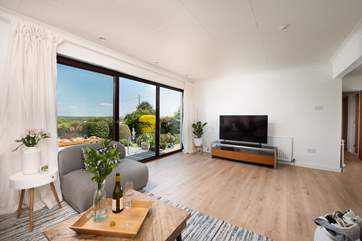 The patio doors open up onto the terrace and sea view.