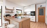 Step in and discover the welcoming kitchen and dining space. - Thumbnail Image