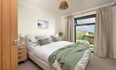 Delightful bedroom two has another king-size bed and overlooks the pretty garden. - Thumbnail Image