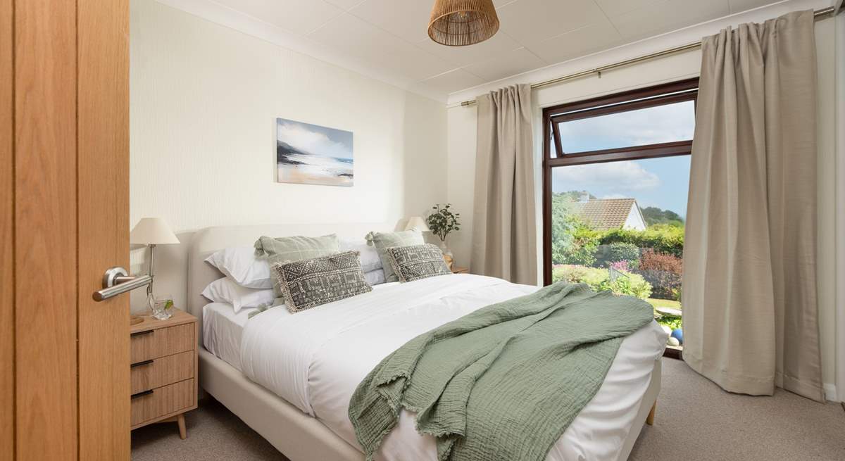 Delightful bedroom two has another king-size bed and overlooks the pretty garden.