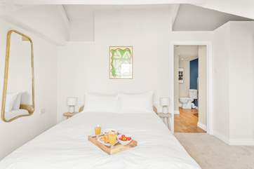 The bedroom links into a large en suite shower-room.