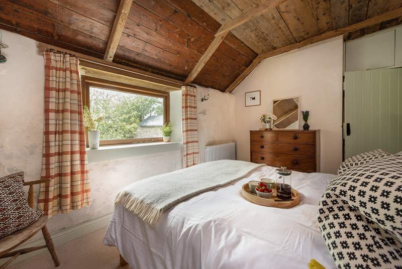Cleverly positioned windows allow lots of light into bedroom 1 which looks out over the private garden.