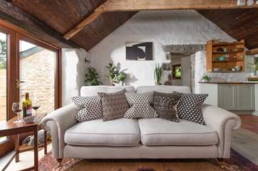The cosy sofa, the perfect place to relax after a busy day.