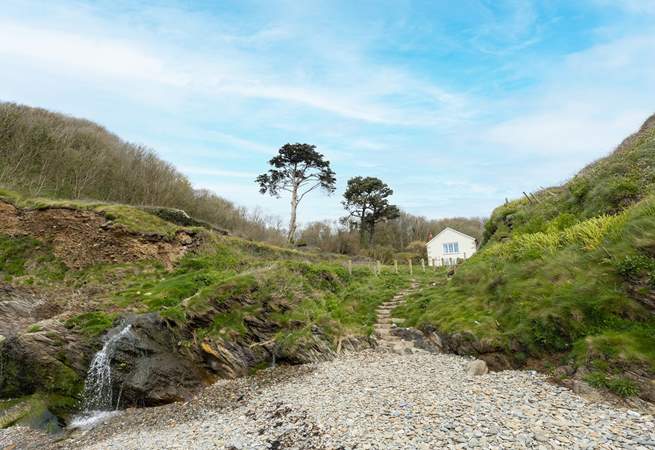 Looking back from the beach to Hallane Mill. The steps are the public footpath and there is private access to the path from the garden.