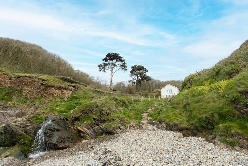 Looking back from the beach to Hallane Mill. The steps are the public footpath and there is private access to the path from the garden.