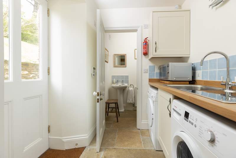 Four steps lead down to the back door which takes you into the handy utility-room with access to the ground floor cloakroom. 