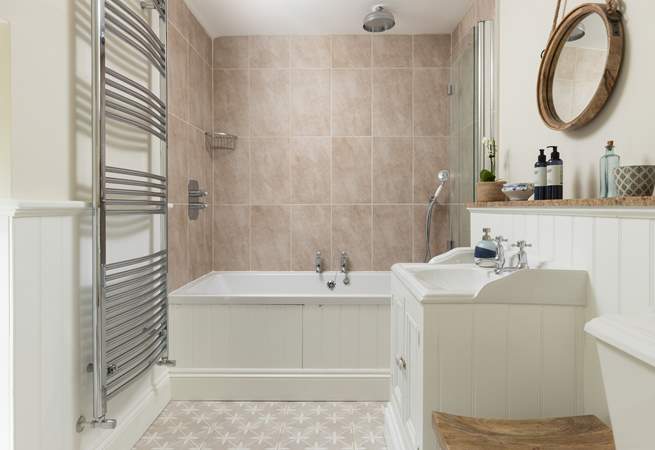 The super family bathroom has a bath with shower over giving you the choice of a long soak or a refreshing shower.