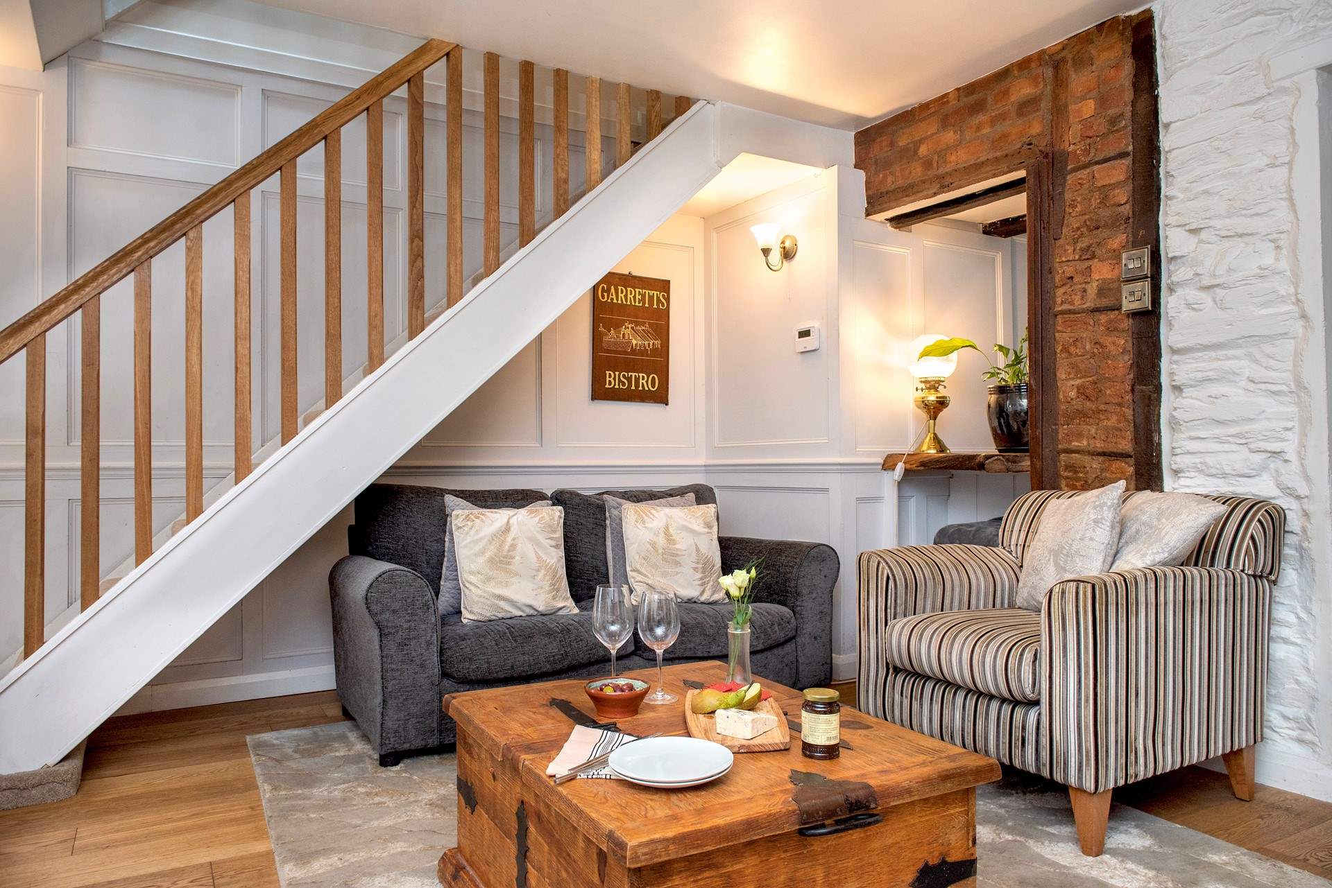 Stairs lead up from the second sitting-area.