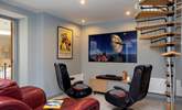 Young and old will love to escape to the cinema room, which leads off from the second bedroom. - Thumbnail Image