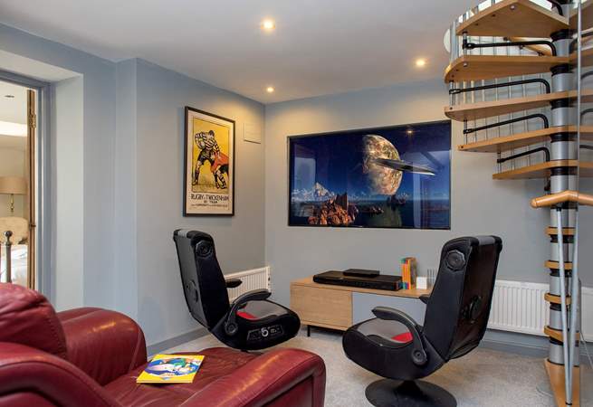 Young and old will love to escape to the cinema room, which leads off from the second bedroom.