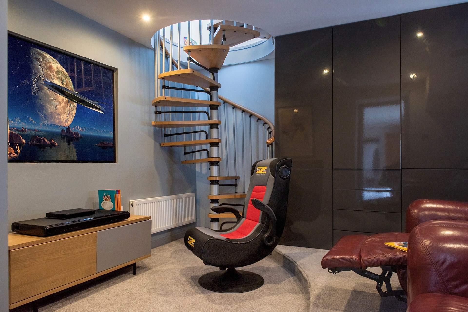 The spiral staircase leads up to bedroom 3.