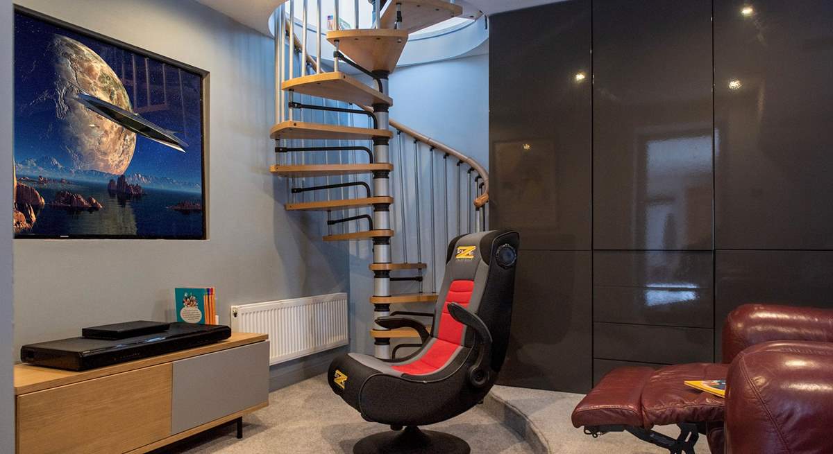 The spiral staircase leads up to bedroom 3.