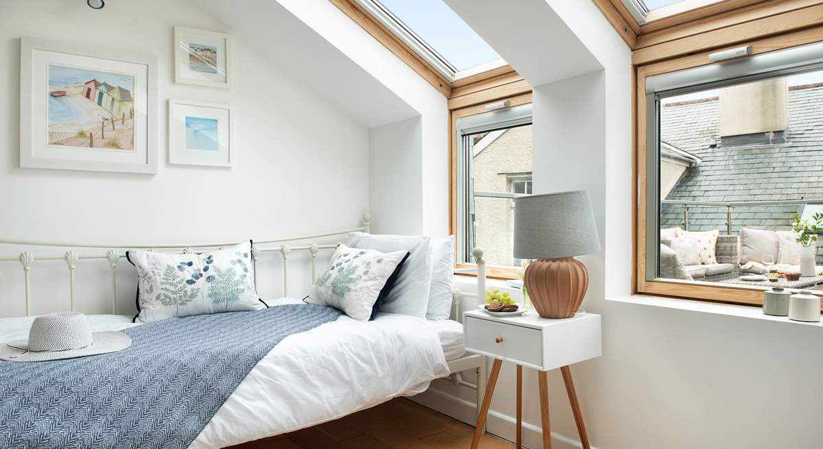 This pretty room looks out onto the roof terrace.