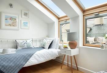 This pretty room looks out onto the roof terrace.