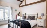 Exposed beams add to the character in bedroom 4. - Thumbnail Image