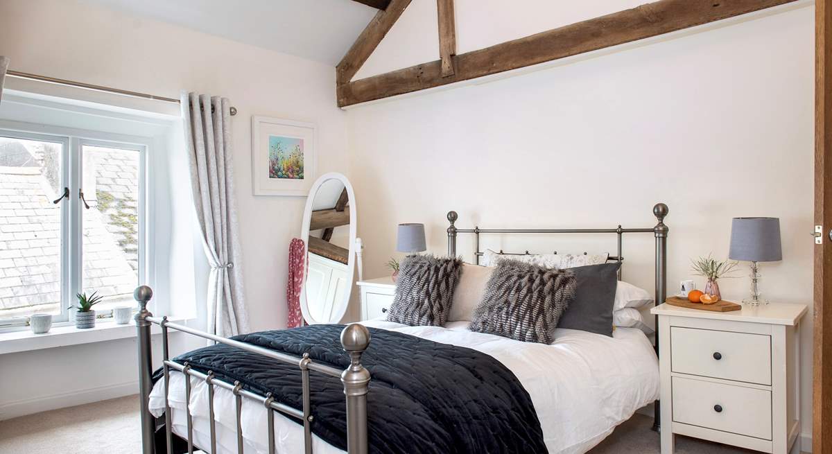 Exposed beams add to the character in bedroom 4.