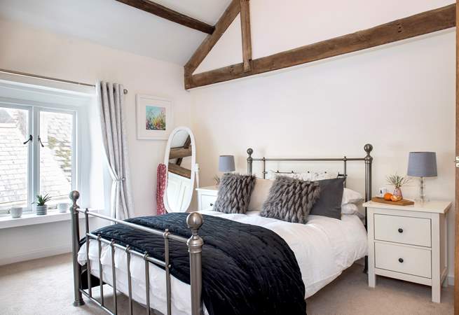 Exposed beams add to the character in bedroom 4.