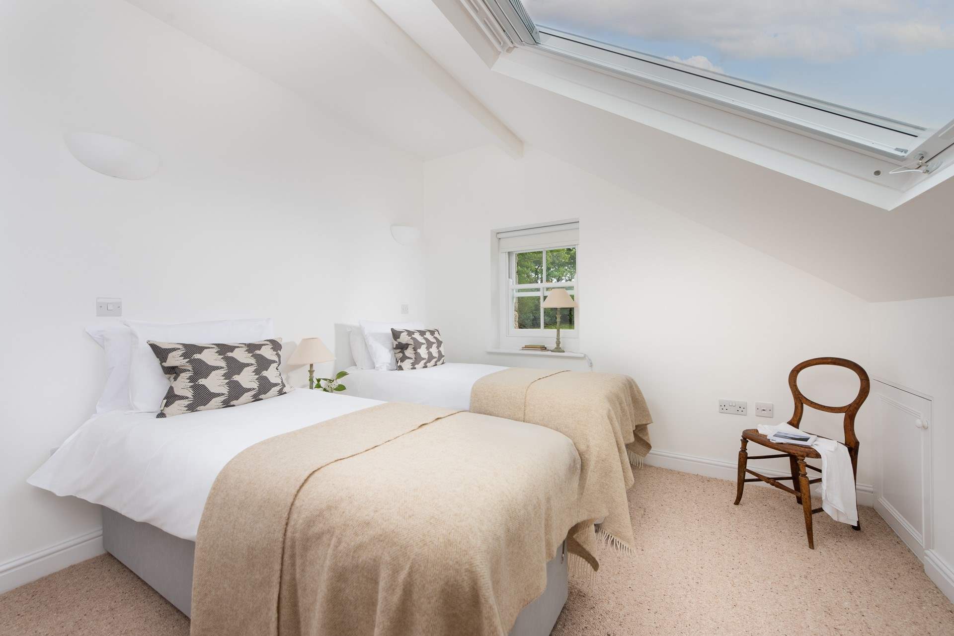 Head upstairs to find the other two bedrooms. Bedroom 2 is a gorgeous twin room, which can also be made up as a king, if you prefer.