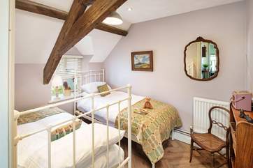 Time for a story. This sweet twin room is located on the first floor.