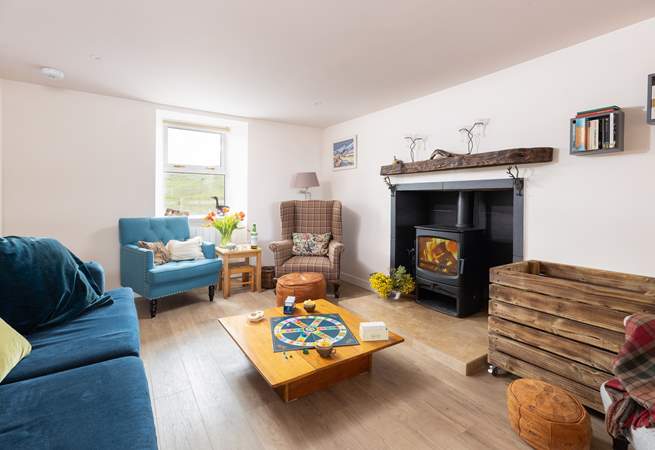 The cosy living-room with wood-burner.