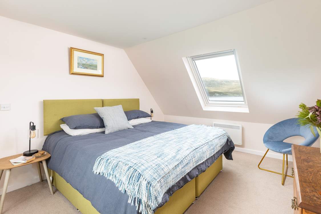 Retire to the peaceful main bedroom.