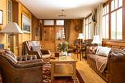 Retreat to the sitting-room to unwind and take a moment to enjoy the ambience of your home for the next few days.