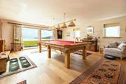 Challenge each other to a game of snooker or darts.
