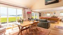 The games-room and library with floor to ceiling windows overlooking the Kyle and Cape Wrath.