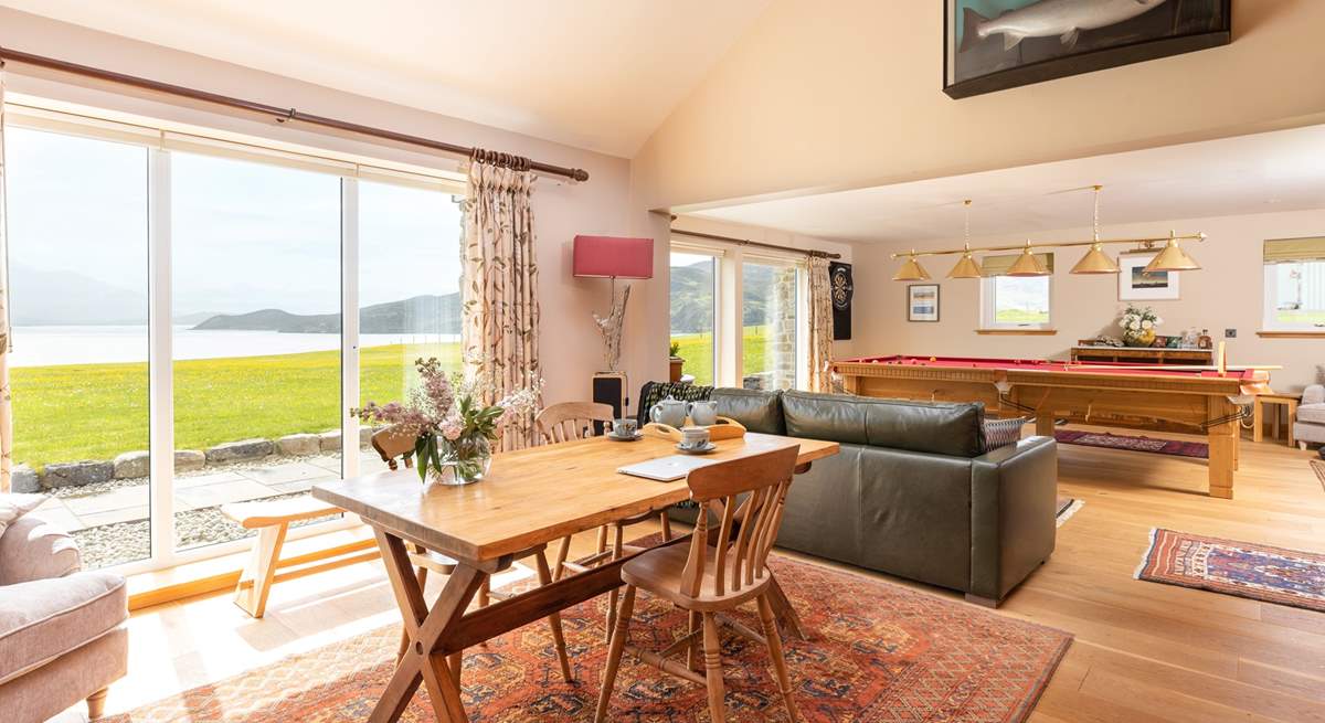 The games-room and library with floor to ceiling windows overlooking the Kyle and Cape Wrath.