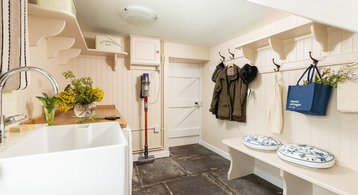 The boot-room with laundry is perfect for storing outdoor wear.