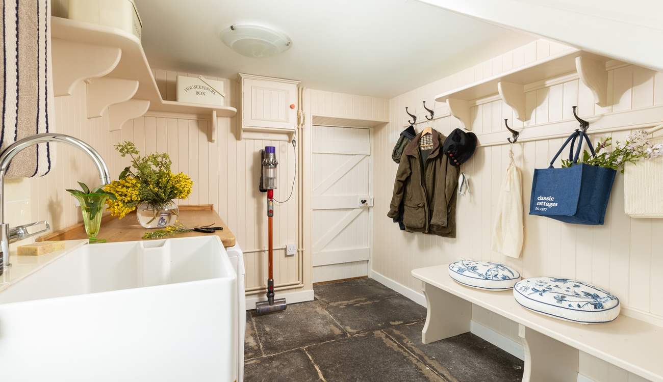The boot-room with laundry is perfect for storing outdoor wear.